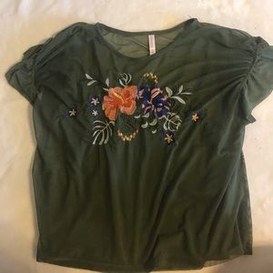 a mesh shirt with an attached tank top underneath